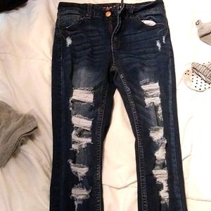 Skinny mid rise ripped jeans